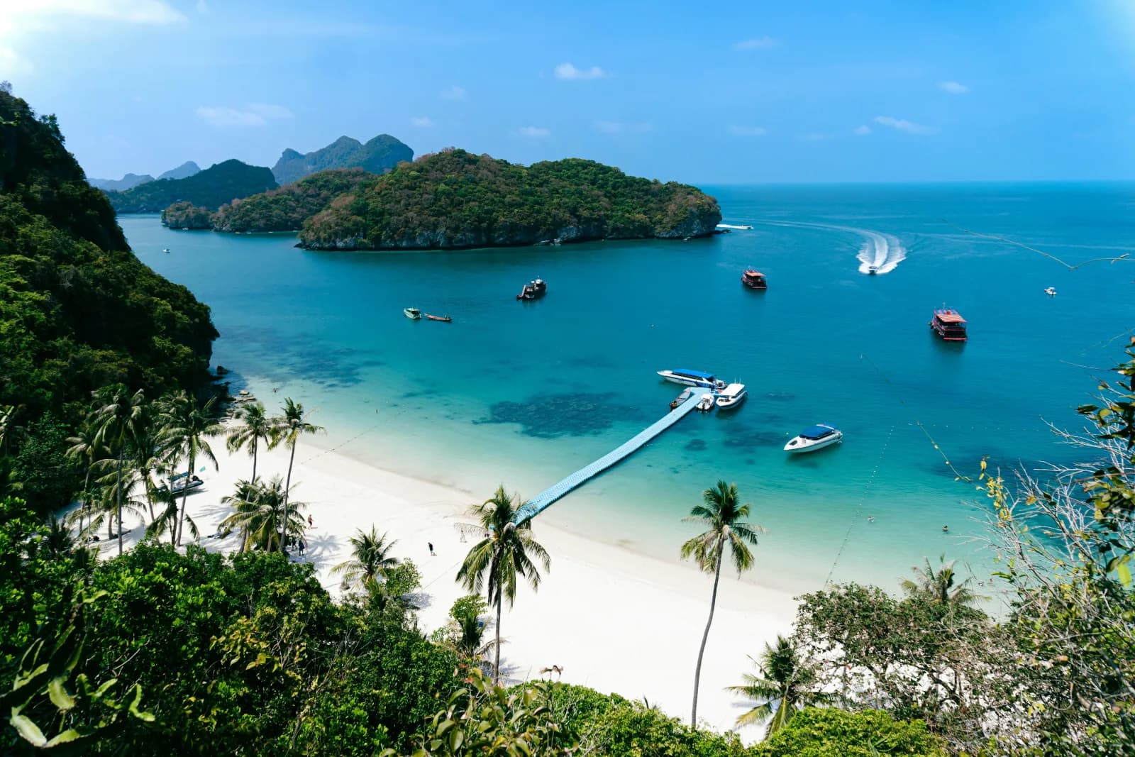 Tropical beach with longtail boats on Ko Chang