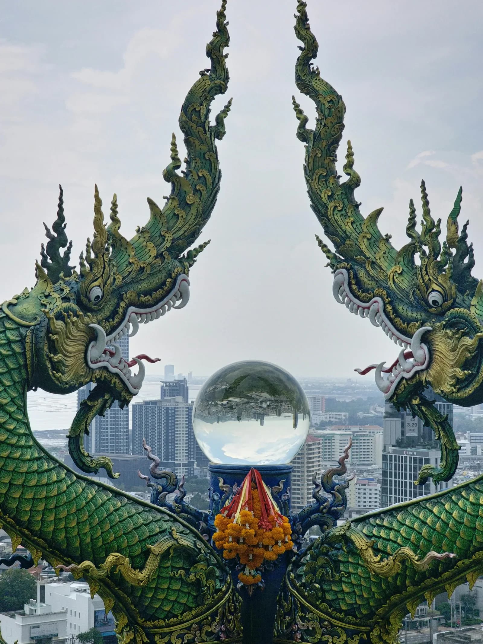 Naga sculptures overlooking the Sriracha cityscape